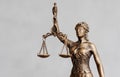 close up, themis is goddess of justice statuette on dark background. symbol of law with scales Royalty Free Stock Photo