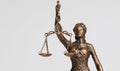 close up of Themis goddess of justice statuette on light background. symbol of law Royalty Free Stock Photo