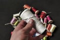 close-up there are lots of colorful spools of thread, thick sewing thread, big needle Royalty Free Stock Photo