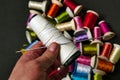 close-up there are lots of colorful spools of thread, thick sewing thread, big needle Royalty Free Stock Photo