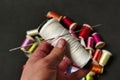 Close-up there are lots of colorful spools of thread, thick sewing thread, big needle Royalty Free Stock Photo