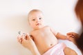 Close-up thermometer. Mother measuring temperature of her ill kid. Sick child with high fever laying in bed. Royalty Free Stock Photo