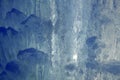 close up of thick blue ice and many icicles