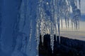 close up of thick blue ice and many icicles