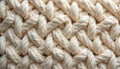 Close-up of a thick, cream-colored woven rope texture. The interlaced cords form a repeating geometric pattern, offering a Royalty Free Stock Photo