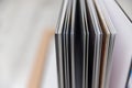 Close up of thick and rigid wedding album pages in a book with acrylic cover