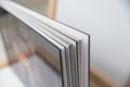 Close up of thick and rigid wedding album pages in a book with acrylic cover