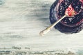 Close up of thick sweet strawberry jam with old spoon. Royalty Free Stock Photo