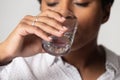 Close up of thirsty biracial female drinking pure water