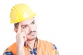 Close-up of thoughtful constructor with helmet and protection equipment Royalty Free Stock Photo