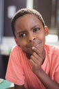 Close-up of thoughtful schoolboy in classroom