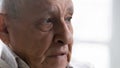 Close up thoughtful upset elderly man feeling lonely and depressed Royalty Free Stock Photo