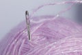 Close up of thread through a needle Royalty Free Stock Photo