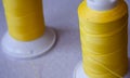 Close-Up Of Thread Spools for sewing machine