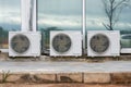 Close-up of three air conditioner outdoor units