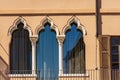 Ancient Windows with Arch in Venetian Gothic style - Brescia Lombardy Italy Royalty Free Stock Photo