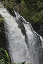 Close up of Three Bears Falls, also known as Upper Waikani Falls, cascading down a cliffside