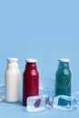 Close up of three different types detox drinks on blue Royalty Free Stock Photo
