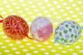 Close-up of three Easter eggs on green background Royalty Free Stock Photo