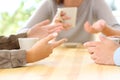 Three friends hands talking in a bar Royalty Free Stock Photo