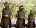 Close up three golden Buddha ornaments with serene expression,Myanmar