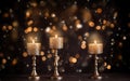 Close up of three golden burning candles in vintage candlesticks on the wooden table. Copy space. Christmas light