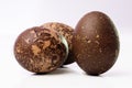 Close-up of three grungy colored Easter eggs on white Royalty Free Stock Photo