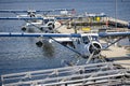 Close up of three Harbour Air seaplanes moored at floating terminal in Vancouver, British Columbia, Canada