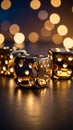 Close up of three metallic dice on a reflective surface with bokeh lights in the background. Royalty Free Stock Photo