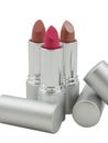 Close-up of three multicolored lipsticks