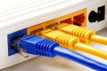 Close up on network cables connected to WAN and LAN ports on router Royalty Free Stock Photo