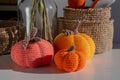 Close-up three orange crocheted pumpkins. The concept of autumn decor of the house is handmade