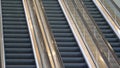 CLOSE UP: Three escalator staircases moving up and down in abandoned building. Royalty Free Stock Photo