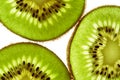 Close-up of three pieces of fresh ripe green kiwi. Kiwi or Chinese gooseberry close-up. Freshly squeezed juice, a slice Royalty Free Stock Photo