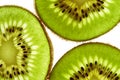 Close-up of three pieces of fresh ripe green kiwi. Kiwi or Chinese gooseberry close-up. Freshly squeezed juice, a slice Royalty Free Stock Photo