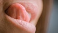 Close Up Three Quarter Macro Shot of a Mouth with Perfect White Teeth. Female is Licking Royalty Free Stock Photo