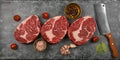 Close up three raw beef ribeye steaks on table Royalty Free Stock Photo