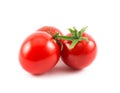 Close up of three red small cherry tomatoes on a white background