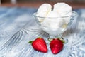 Tasty vanilla ice cream in bowl and strawberries Royalty Free Stock Photo