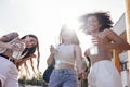 Close up of three teenage girls in casual clothes drinking tasty lemonade on the go Royalty Free Stock Photo