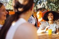 Close up of three teenage girls in casual clothes drinking tasty lemonade on the go Royalty Free Stock Photo