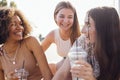 Close up of three teenage girls in casual clothes drinking tasty lemonade on the go Royalty Free Stock Photo