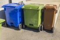 Close up of three trash cans for sorting storage of food waste, trash and paper for printing.