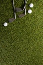 Close up of three white golf balls and golf clubs on grass with copy space Royalty Free Stock Photo