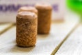Several wine corks stand on wooden surface close Royalty Free Stock Photo