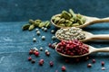 Close up three wooden spoons with colorful spices Royalty Free Stock Photo