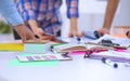 Close-up of three young creative designers working on project together. Team work Royalty Free Stock Photo