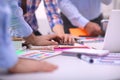 Close-up of three young creative designers working on project together. Team work Royalty Free Stock Photo