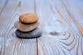 Close up of Three zen stones on used wood