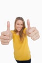 Close-up on a the thumbs-up of a blonde woman Royalty Free Stock Photo